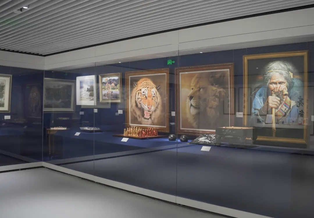 Alt-Text: Wall mounted museum artifact display case for framed paintings and art collection gallery exhibition